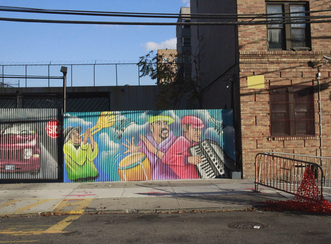 Murals and graffitti on Bronx Blvd., near houses facing the river.