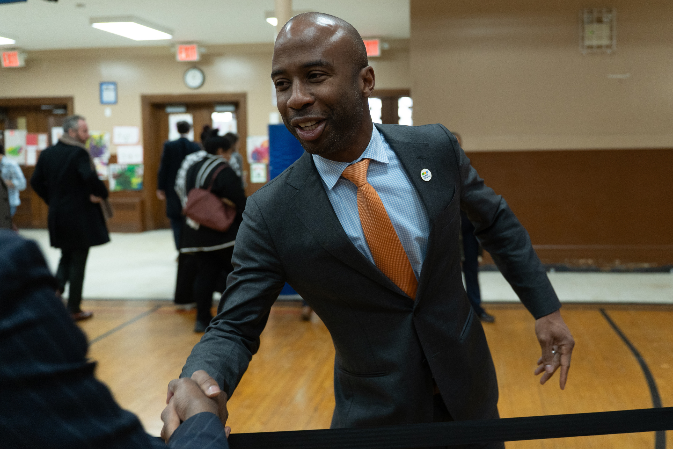 Photo of NYC Schools Chancellor Kamar Samuels shaking hands
