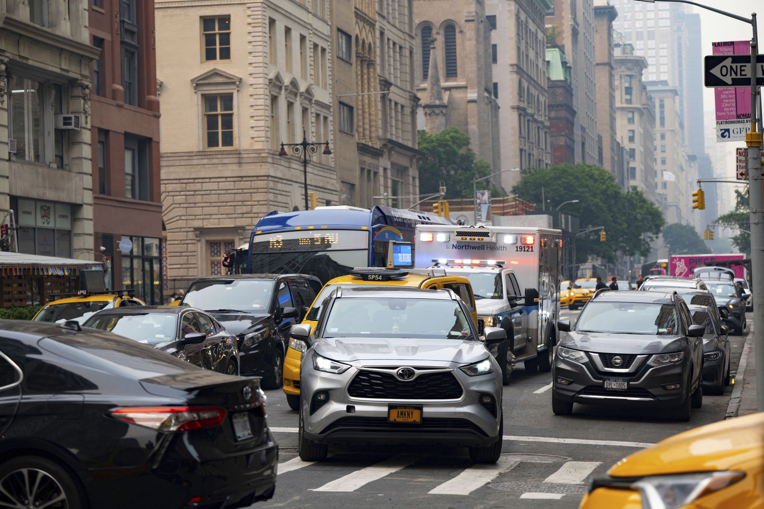 Ambulance in traffic in Manhattan. Alamy Live News via AP.